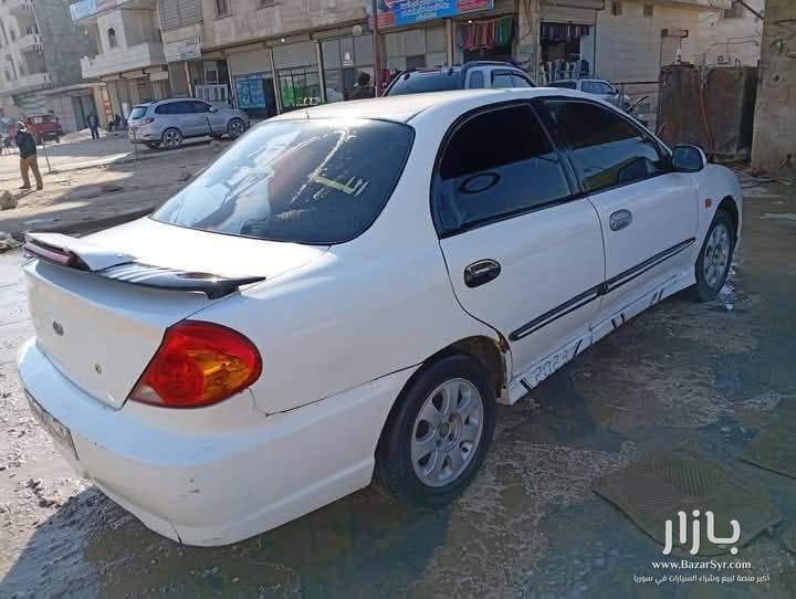 بسم الله نبدا سياره كيا سيراتو موديل 2003 محرك ديزل فوكس بخاخ رفيع جديد مافي بخار كهرباء بل الكامل شغاله بلور كهربا مجنطه مرايا كهربا دوزان دهب دولاليب  - كيا - 2003 - محافظة إدلب - صورة 2 من 6